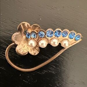 vintage gold-tone floral spray brooch with blue rhinestones and faux pearl